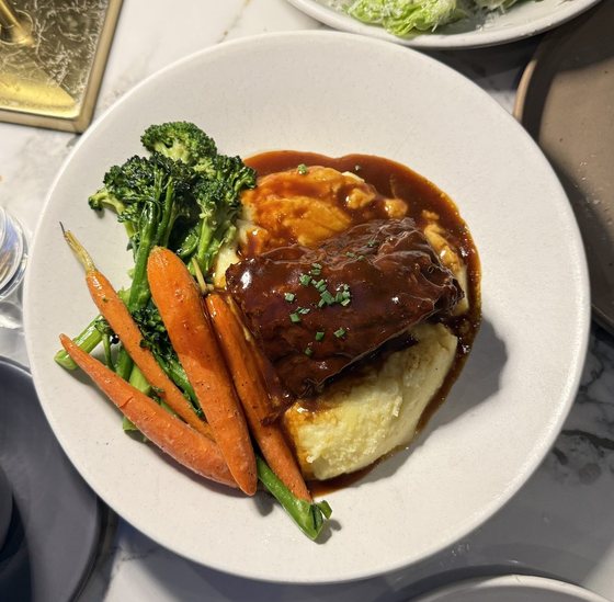 Braised short rib with mashed potatoes, broccolini and carrots